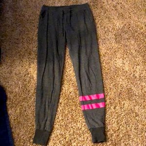 Grey joggers, pink stripes on one leg, pockets